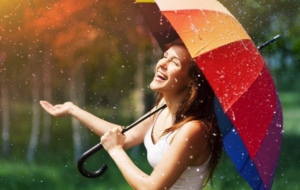 Happy-woman-in-the-rain-Stock-Photo